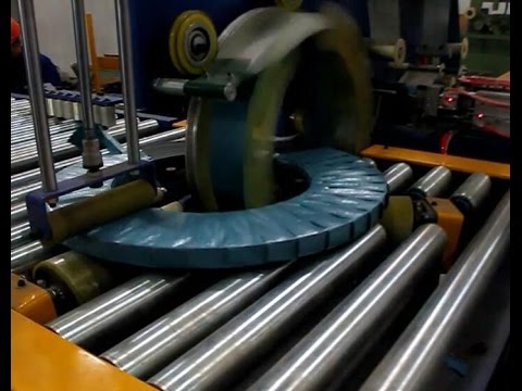 “Revolutionary Coil Packaging Line: Streamlined Wrapping and Tapping in Under 40 Words!”