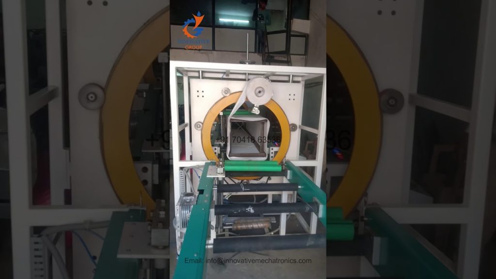 Compact orbital stretch film wrapping machine for extrusions profiles.
