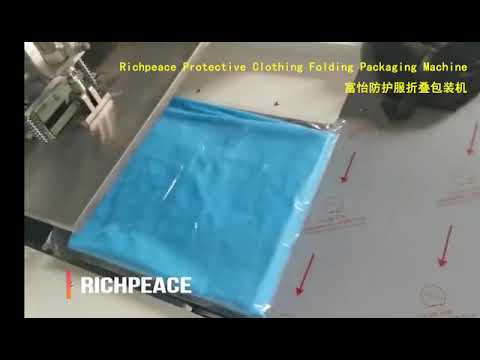 Folding machine for protective clothing packaging.