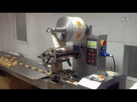 Horizontal meringue packing machine with flow wrapper under 12 words.
