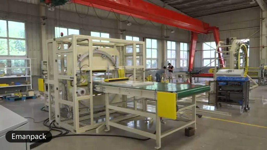 Orbital machine packs doors and windows using stretch wrapping.