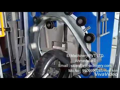 Coil Wrapping Machine: Vertical Tyre Packaging with External Roll Mounting Coil Wrapping Machine: Vertical Tyre Packaging with External Roll Mounting