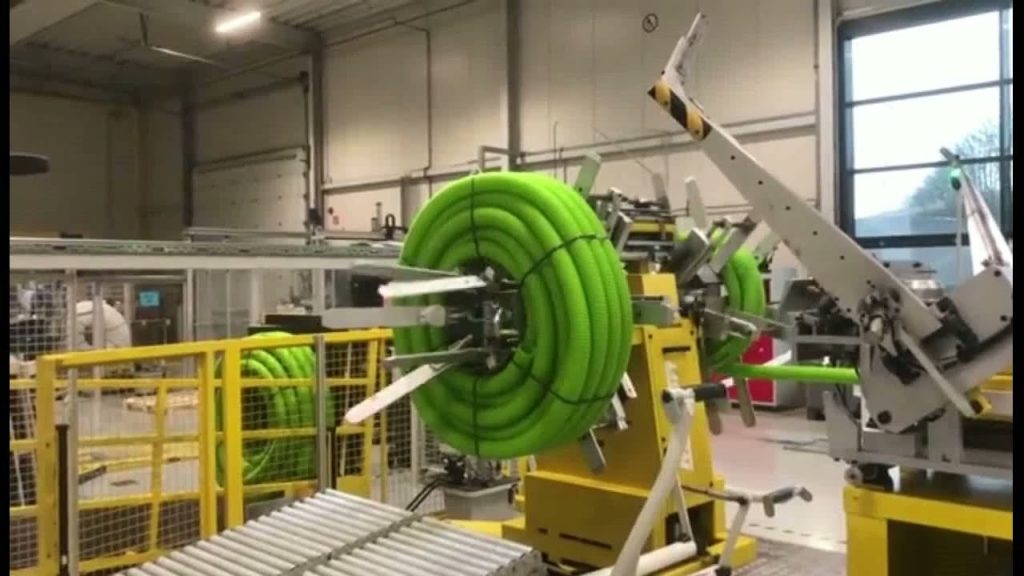 Innovative Coiling and Strapping Machine for Double Wall Corrugated Hoses: A Game-Changing Solution. Innovative Coiling and Strapping Machine for Double Wall Corrugated Hoses: A Game-Changing Solution.