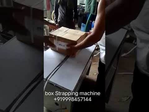 “Revolutionize Packaging Efficiency: Compact Handheld Strapping Machine for Seamless Box Packing”